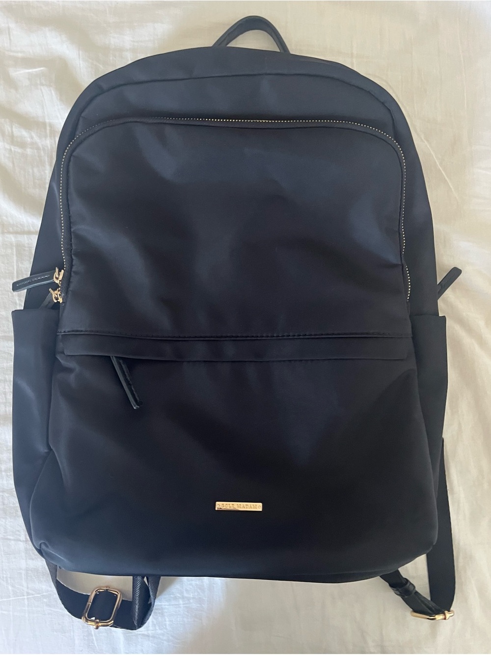 Black nylon backpack with gold hardware
